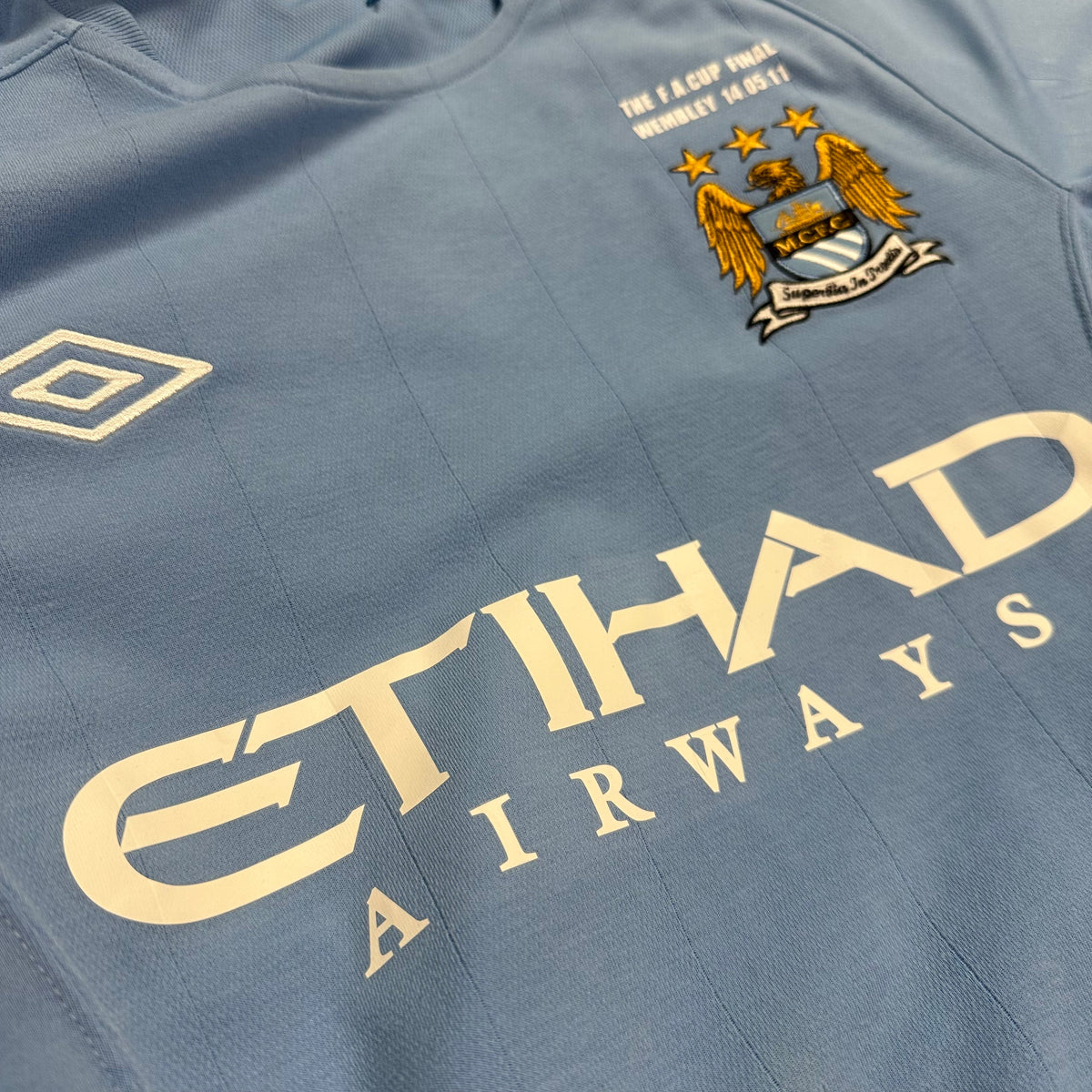 2010-11 Manchester City Home Shirt Yaya Toure 42 FA Cup [Excellent] — Looking after your Manchester City Home jersey | The Vault