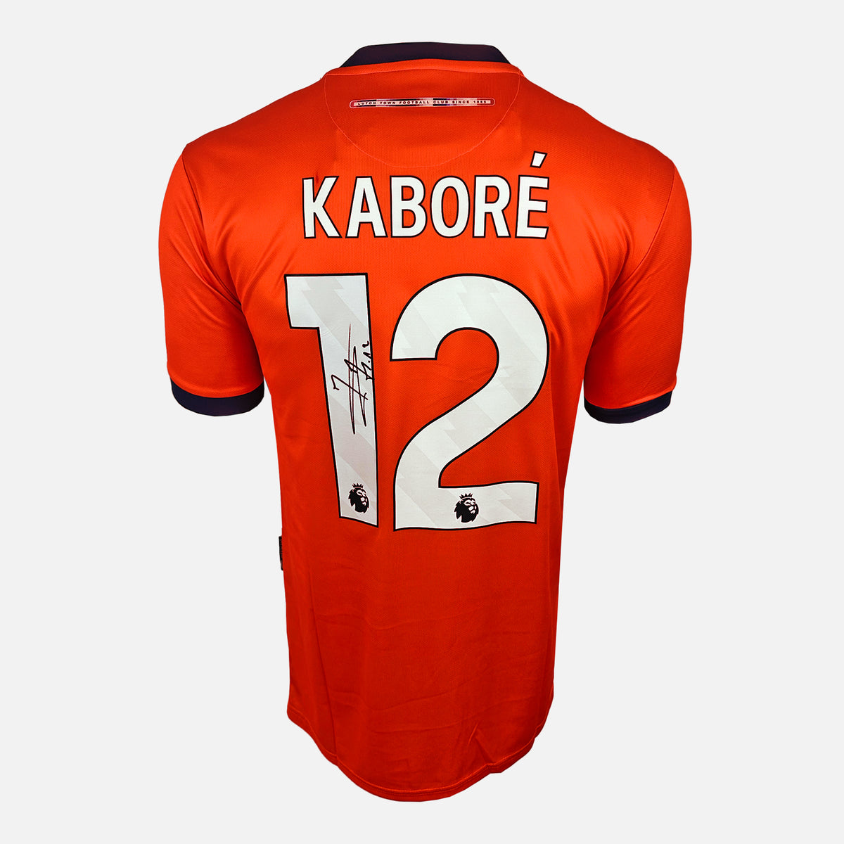 Issa Kabore Signed Luton Town Shirt 2023-24 Home [12] — Luton Town signed shirt from the 2023 to 2024 season | The Vault
