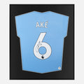 Framed Ake Signed Shirt, New Manchester City Home [Lite]